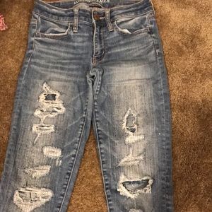 Distressed American Eagle jeans.